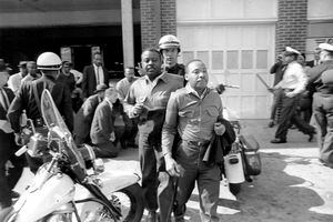 (AP Photo)

In this file photo taken April 12, 1963 Rev. Ralph Abernathy, left, and Rev. Martin Luther King Jr., right are taken by a policeman as they led a line of demonstrators into the business section of Birmingham, Ala.  Arrested for leading a march against racial segregation in 1963, King Jr. spent days in solitary confinement writing his “Letter From Birmingham Jail,” which was smuggled out and stirred the world by explaining why Black people couldn't keep waiting for fair treatment.