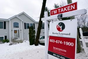 (Charles Krupa | AP photo)

An "I'm Taken" placard rests on a real estate for sale sign outside a home, Dec. 10, 2020, in Manchester, N.H.