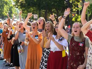 (Rick Egan | The Salt Lake Tribune) Latter-day Saint missionaries cheer at the Days of '47 Parade in Salt Lake City in 2021. A new study reveals the value of young women serving missions.