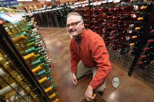 (Francisco Kjolseth | The Salt Lake Tribune) Salt Lake Tribune news columnist Robert Gehrke learns the ropes while working a shift at the Wine Store in Salt Lake City on Thursday, Dec. 9, 2021.