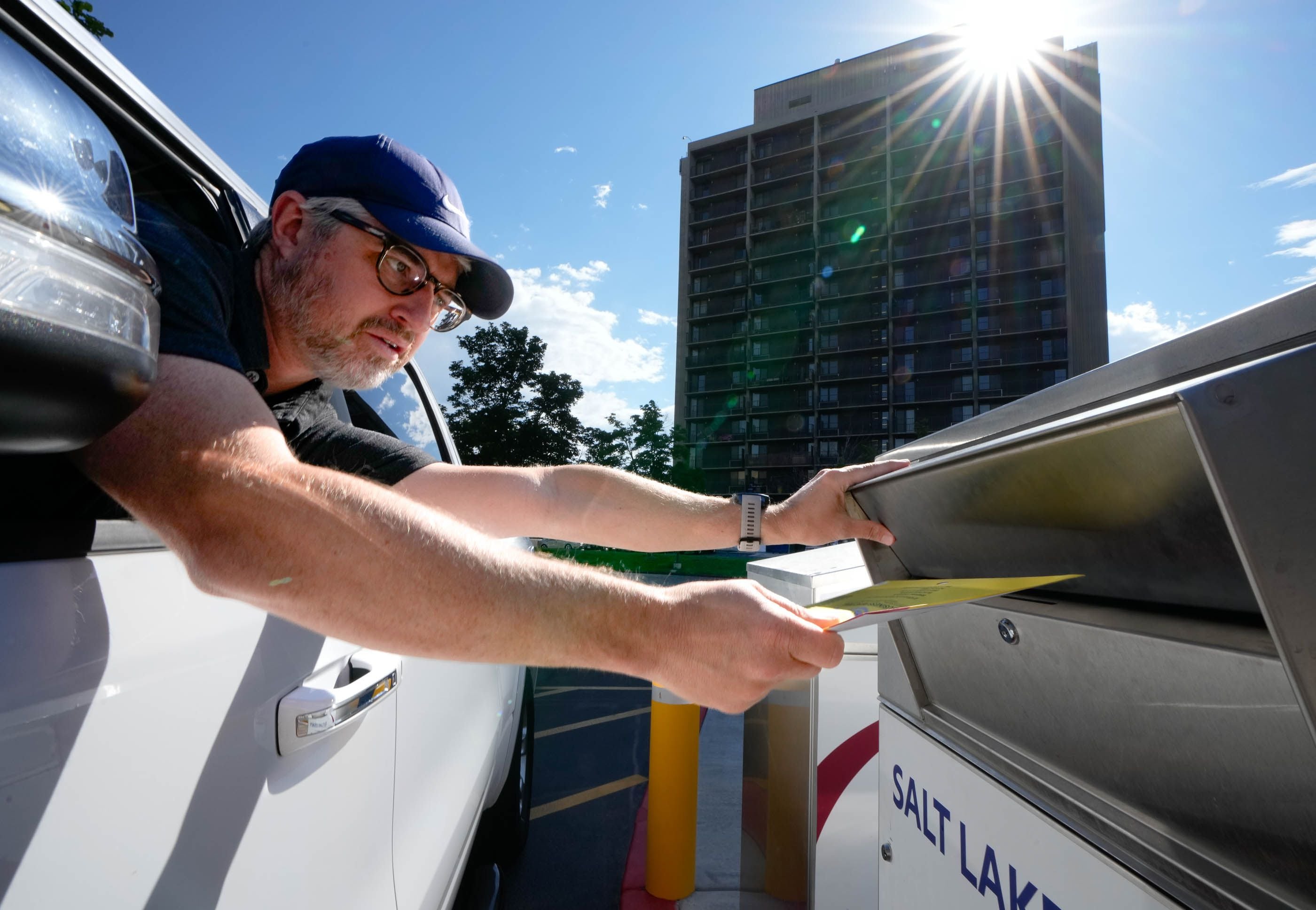 (Francisco Kjolseth | The Salt Lake Tribune) Corey Hankey drops his ballot into the ballot box at the Salt Lake County Government Center during primary Election Day on Tuesday, June 28, 2022.