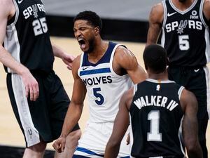 Minnesota Timberwolves guard Malik Beasley (5) reacts after scoring against the San Antonio Spurs during the second half of an NBA basketball game in San Antonio, Wednesday, Feb. 3, 2021. (AP Photo/Eric Gay)