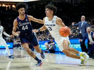 (Jeff Dean |  AP file photo) Xavier's Colby Jones, right, and Connecticut's Andre Jackson Jr. are two players who could possibly be picked by the Utah Jazz with the No. 28 selection in the 2023 NBA draft.