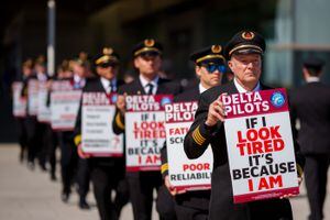 (Trent Nelson  |  The Salt Lake Tribune) Delta Air Lines pilots protest at Salt Lake City International Airport on Thursday, April 7, 2022.