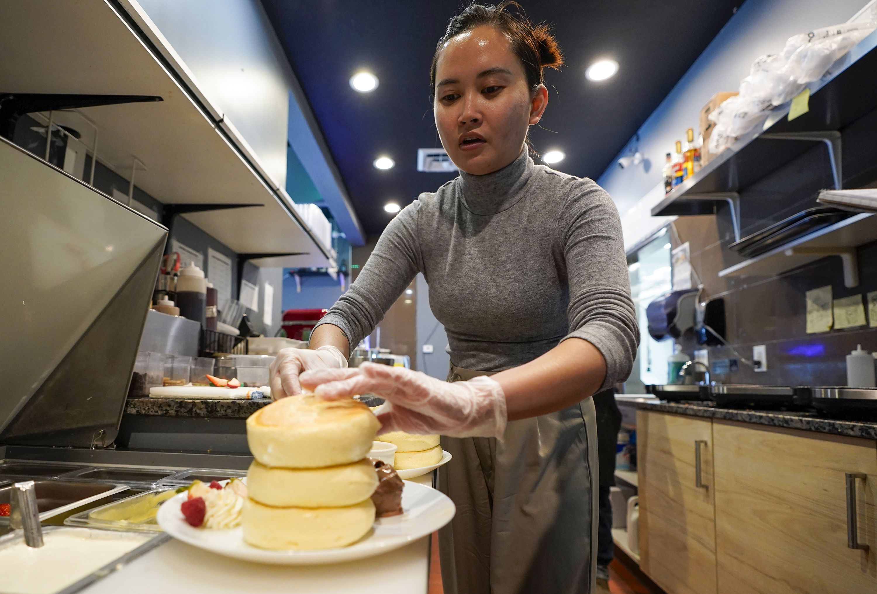 (Chris Samuels | The Salt Lake Tribune) Irie Cao makes Japanese fluffy pancakes at Kumo Cafe in South Salt Lake, Wednesday, April 10, 2024.