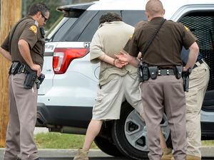 (Chris Samuels | The Salt Lake Tribune) A suspect is taken into custody after police responded to a confrontation at a yoga studio on 700 East in Salt Lake City, Wednesday, June 29, 2022.