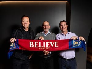 (Courtesy Real Salt Lake) New Real Salt Lake owners Ryan Smith, left, and David Blitzer, right, pose with Major League Soccer commissioner Don Garber. On Wednesday, Blitzer and Smith were announced as the MLS franchise's new owners.