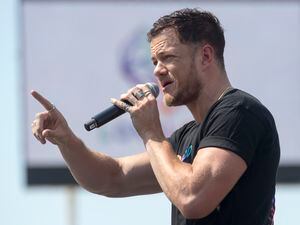 (Rick Egan  |  The Salt Lake Tribune)     Loveloud Founder Dan Reynolds says a few words to the crowd at the start of the Loveloud Festival in the early afternoon, at Rice-Eccles Stadium, Saturday, July 28, 2018.