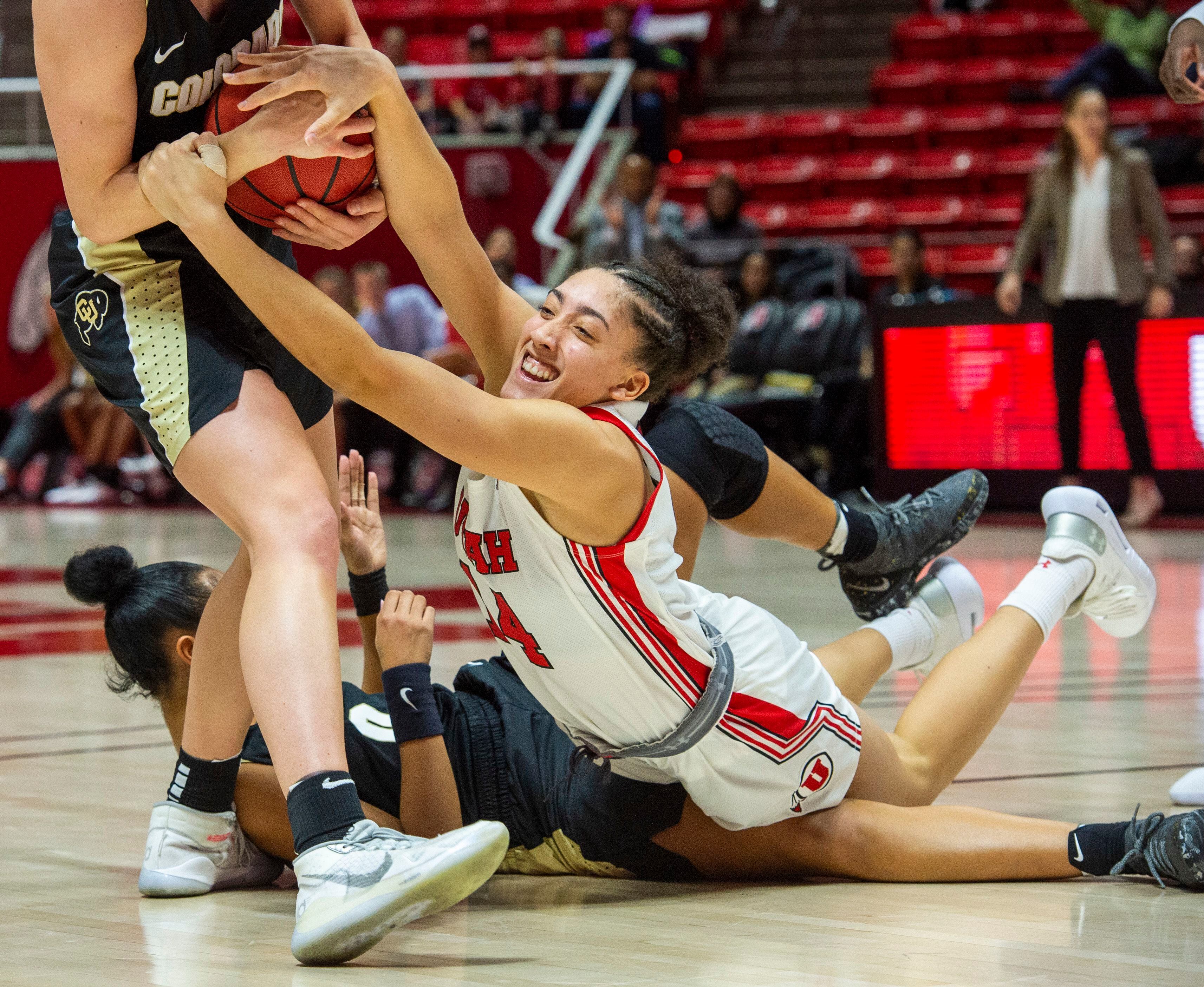 (Rick Egan | The Salt Lake Tribune) Utah Utes guard Niyah Becker (14) tries to grab the ball from Colorado Buffaloes guard Emma Clarke (3), in PAC-12 basketball action between the Utah Utes and the Colorado Buffaloes, at the Jon M. Huntsman Center, Sunday, Nov. 29, 2019.