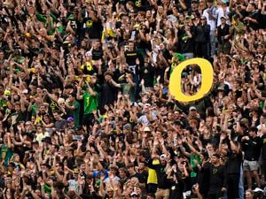(Andy Nelson |AP) Oregon students and fans cheer the during the first half of an NCAA college football game against BYU Saturday, Sept. 17, 2022, in Eugene, Ore.