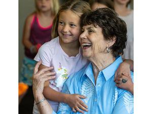 (Rick Egan | The Salt Lake Tribune) Louise Bitner get hugs from her student, Emma Croft, on her last day as a teacher at Dilworth Elementary School, on Friday, June 3, 2022. Bitner is retiring after 51 years as a kindergarten and first grade teacher.