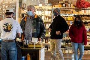 (Rick Egan | The Salt Lake Tribune) Customers wear masks as they wait to order their food, at Caputo's in Salt Lake City, Wednesday, Jan. 12, 2022.