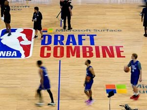 (Nam Y. Huh  |  The Associated Press) Participants walk on the court during the 2023 NBA Draft Combine in Chicago.