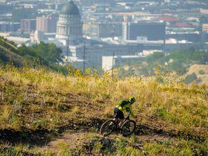 (Trent Nelson  |  The Salt Lake Tribune) A mountain biker rides the 19th Ave trail in the Salt Lake City foothills in September.