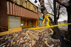 (Trent Nelson  |  The Salt Lake Tribune) Bricks that fell from the facade of Red Rooster Records in Magna a week after an earthquake in March 2020.