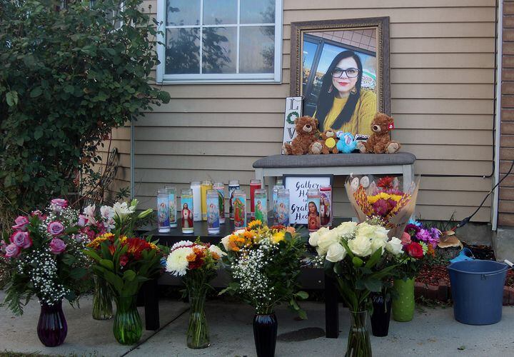 (Connor Sanders | The Salt Lake Tribune) Friends and family members leave flowers and candles at a shrine for Gabriela Sifuentes Castilla in Taylorsville on Tuesday, Oct. 19, 2021. Sifuentes Castilla was fatally shot at home early Sunday morning.