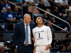 (Rachel Rydalch | The Salt Lake Tribune) Brigham Young Cougars head coach Mark Pope, pulls Brigham Young Cougars guard Trey Stewart (1) off to the side during the second period of a NIT game against Long Beach State 49ers at the Marriott Center on Wednesday, March 16, 2022.