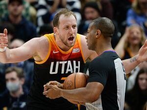 (Chris Samuels | The Salt Lake Tribune) Guard Joe Ingles, left, argues a call with referee John Butler as the Utah Jazz play the Dallas Mavericks at Vivint Arena Saturday, Dec. 25, 2021.
