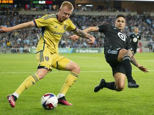 Real Salt Lake defender Justen Glad, left, clears the ball past Minnesota United forward Luis Amarilla, right, in the second half of an MLS soccer match Saturday, May 27, 2023, in St. Paul, Minn. (Alex Kormann/Star Tribune via AP)