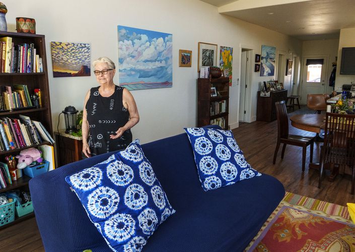 (Leah Hogsten | The Salt Lake Tribune) Arroyo Crossing homeowner and artist Kari Taylor Schreck loves the light and spaciousness of her 1500 square-foot, energy efficient home, which she shows on May 16, 2023. The Arroyo Crossing housing development, built on acreage owned by the Moab Area Community Land Trust, provides permanent affordable housing to some of Moab's families and individuals who could not otherwise afford a home.