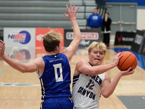 (Francisco Kjolseth | The Salt Lake Tribune) Max Toombs (32) of Corner Canyon goes up against Carson Bailey (0) of Bingham as they compete in the 5 For Fight National Hoopfest Utah County tournament at Pleasant Grove High School on Tuesday, Nov. 22, 2022.