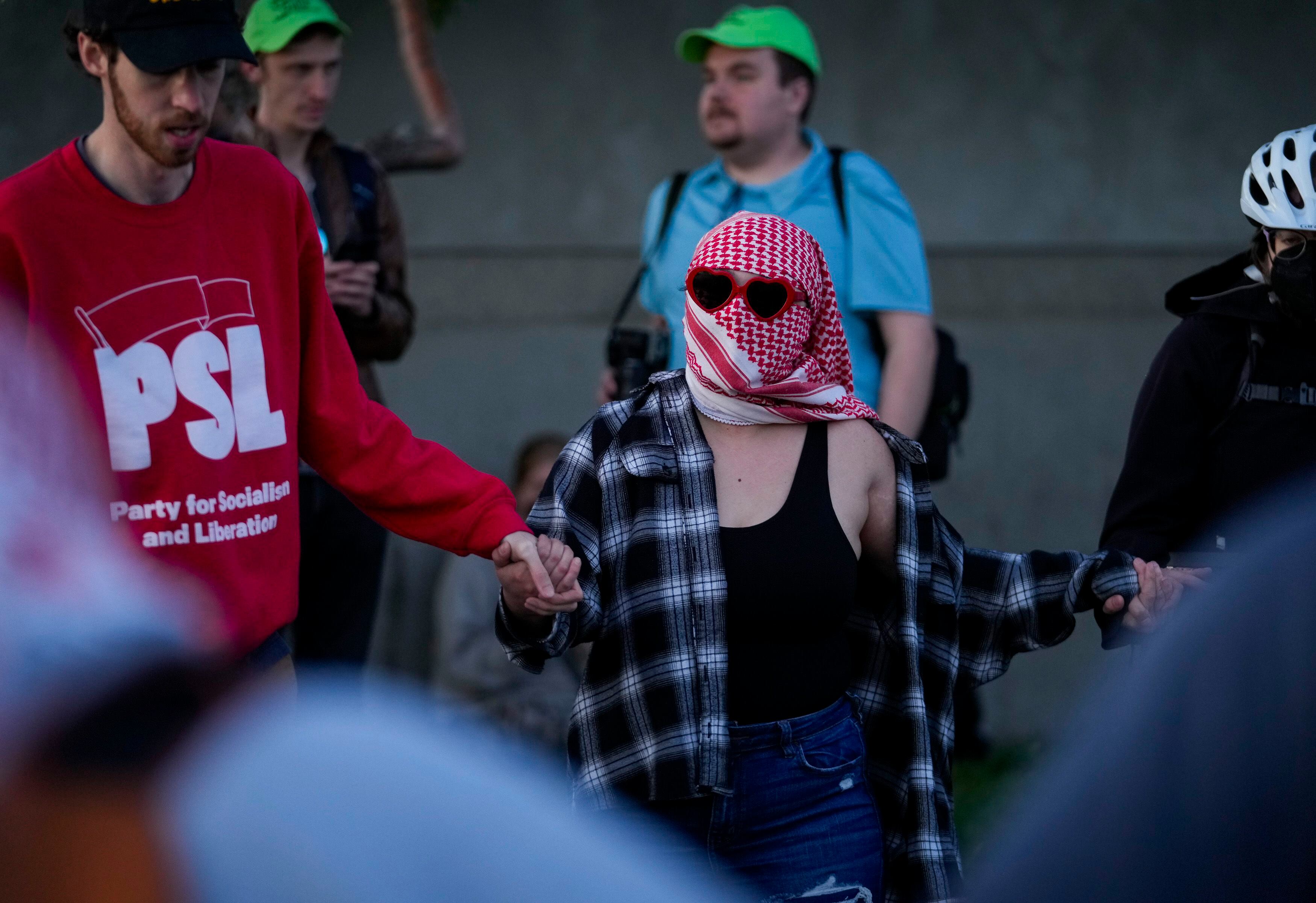 (Bethany Baker | The Salt Lake Tribune) A protester joins in a dance during a pro-Palestine rally at the Salt Lake County Metro Jail in South Salt Lake on Tuesday, April 30, 2024.