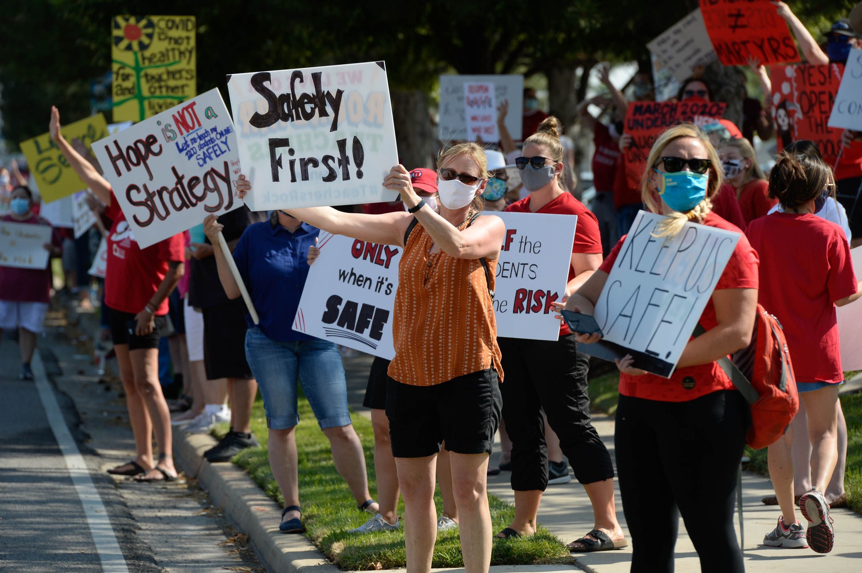 (Francisco Kjolseth  |  Tribune file photo)  Hundreds of Granite School District teachers gather at the district office on Tuesday, Aug. 4, 2020, to protest plans for reopening, which will allow students back into the classroom, like normal.