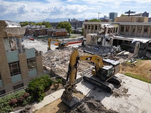 (Francisco Kjolseth | The Salt Lake Tribune) Salt Lake City School District begins the destruction of its longtime office building, shown on Aug. 10, 2022. The headquarters are the last district building to be rebuilt for earthquake safety.