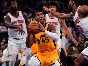 Utah Jazz's Donovan Mitchell, center looks to shoot during the second half of an NBA basketball game against the New York Knicks, Sunday, March 20, 2022, in New York. (AP Photo/Seth Wenig)