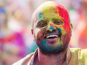 (Rick Egan | The Salt Lake Tribune) Ashish Maheshwari enjoys the spring weather at the Holi Festival of Colors in Spanish Fork, on Saturday, March 26, 2022. The festival with continues on Sunday, included music, yoga, food, and hourly color throws for those attending.  