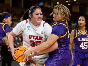 (Mic Smith | AP) Utah's Alissa Pili (35) fights for control of the basketball with LSU's Kateri Poole (55) during the first half of a Sweet 16 college basketball game of the women's NCAA Tournament in Greenville, S.C., Friday, March 24, 2023.