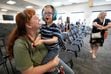 (Francisco Kjolseth | The Salt Lake Tribune) Molly Barrington is joined by her son Jonny, 9, who she said has special needs, at an Alpine School District board of education meeting on Friday, June 30, 2023. Utah’s largest school district will implement a new “consolidated” special education class structure this fall, which will force roughly 150 special education students in grades K-6 to transfer to different schools.