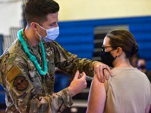 (U.S. Air Force Tech. Sgt. Anthony Nelson Jr./Department of Defense via AP) In this Feb. 9, 2021 photo provided by the Department of Defense, Hickam 15th Medical Group host the first COVID-19 mass vaccination on Joint Base Pearl Harbor-Hickam in Hawaii. Some Utah politicians are backing a provision of the NDAA that would end the military's COVID-19 vaccine mandate.