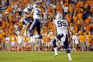 (Wade Payne | AP) BYU's Jake Oldroyd (39) celebrates a 33-yard field goal with teammate Hayden Livingston in the second half of a game against Tennessee to send the game into overtime Saturday, Sept. 7, 2019, in Knoxville, Tenn. The Vols had been scheduled to play BYU in Provo in 2023, but announced Monday they would cancel their trip.