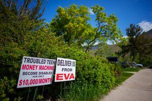 (Trent Nelson  |  The Salt Lake Tribune) Signs in a neighborhood near Eva Carlston Academy, a youth treatment center for girls located in a home in a Salt Lake City suburb, on Tuesday, May 24, 2022.