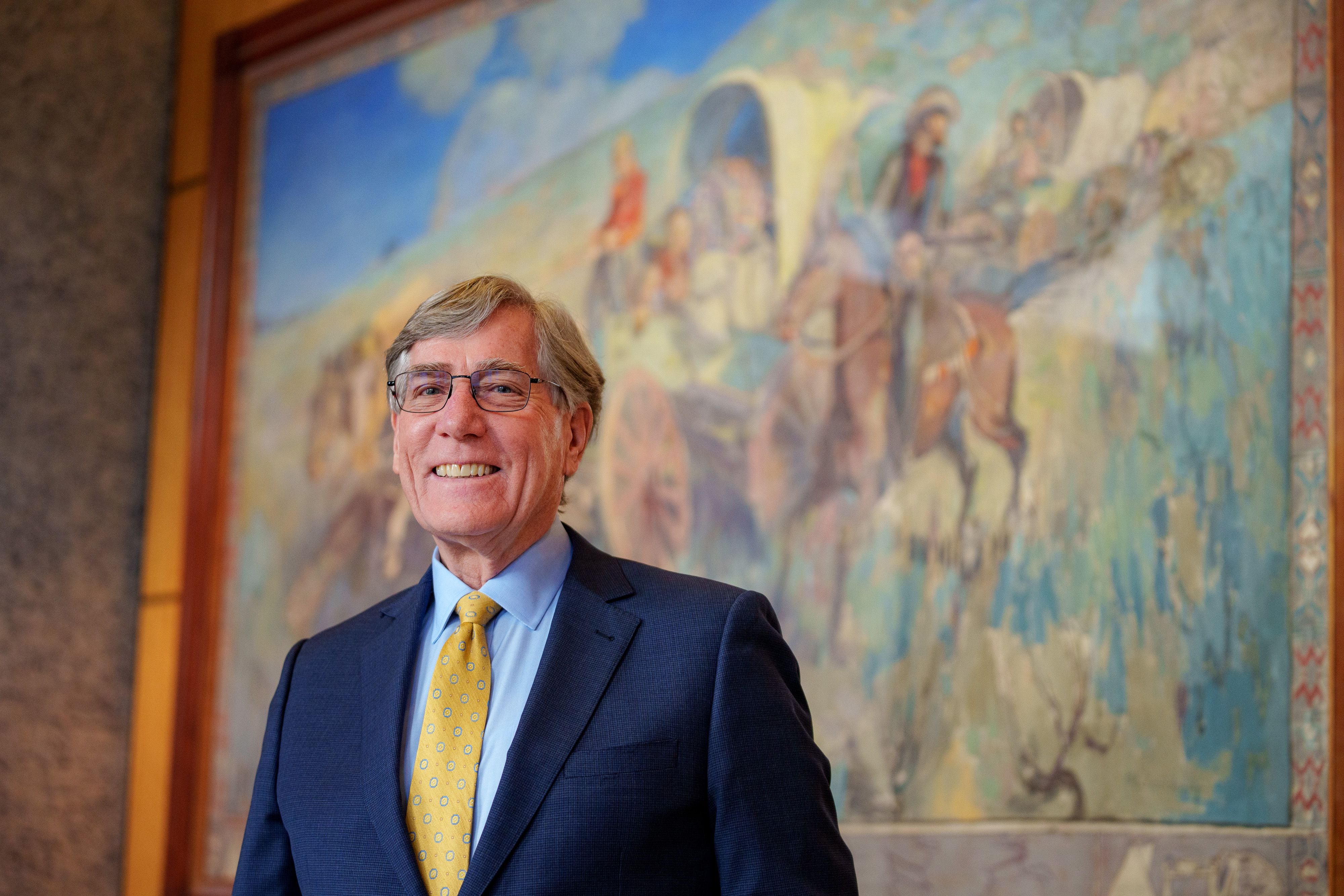(Trent Nelson  |  The Salt Lake Tribune) Scott Anderson, president and CEO of Zions Bank, stands in front of an artwork by Minerva Teichert at the company's headquarters in Salt Lake City on Tuesday, April 2, 2024.