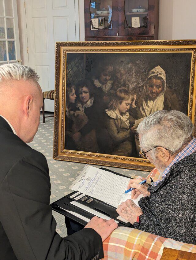 (FBI) Special Agent Gary France watches as Dr. Francis Wood signs an FBI property release form for the recovered Opie painting.