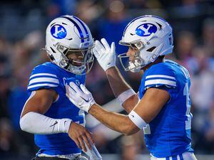 (Trent Nelson  |  The Salt Lake Tribune) Brigham Young Cougars quarterback Jaren Hall (3) and Brigham Young Cougars wide receiver Puka Nacua (12) celebrate a touchdown as BYU hosts East Carolina, NCAA football in Provo on Friday, Oct. 28, 2022.