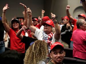 (Lynne Sladky | The AP)Supporters of President Donald Trump turn and yell toward the news media during a rally for evangelical supporters in January 2020 in Miami.