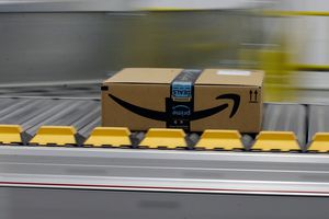 FILE- In this Feb. 9, 2018, file photo, a box for an Amazon prime customer moves through the new Amazon Fulfillment Center in Sacramento, Calif. (AP Photo/Rich Pedroncelli)