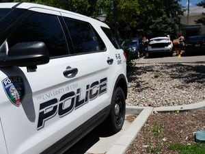 (Francisco Kjolseth | The Salt Lake Tribune) Police cars sit in the parking lot of the University of Utah police department in this June 2019 photo. A state audit from Wednesday, April 20, 2022, found the school has not made all the necessary improvements to its campus policing after the 2018 death of student-athlete Lauren McCluskey.