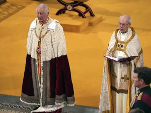 (Aaron Chown | Pool Photo via AP) Britain's King Charles III, left, stands next to Archbishop of Canterbury Justin Welby during his coronation ceremony in Westminster Abbey in London on Saturday, May 6, 2023.