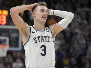 (Eli Lucero | AP) Utah State guard Steven Ashworth reacts after forward Dan Akin was called for a foul against San Diego State during the second half of an NCAA college basketball game Wednesday, Feb. 8, 2023, in Logan, Utah.