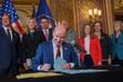 (Trent Nelson  |  The Salt Lake Tribune) Gov. Spencer Cox signs two social media regulation bills during a ceremony at the Capitol building in Salt Lake City on Thursday, March 23, 2023.