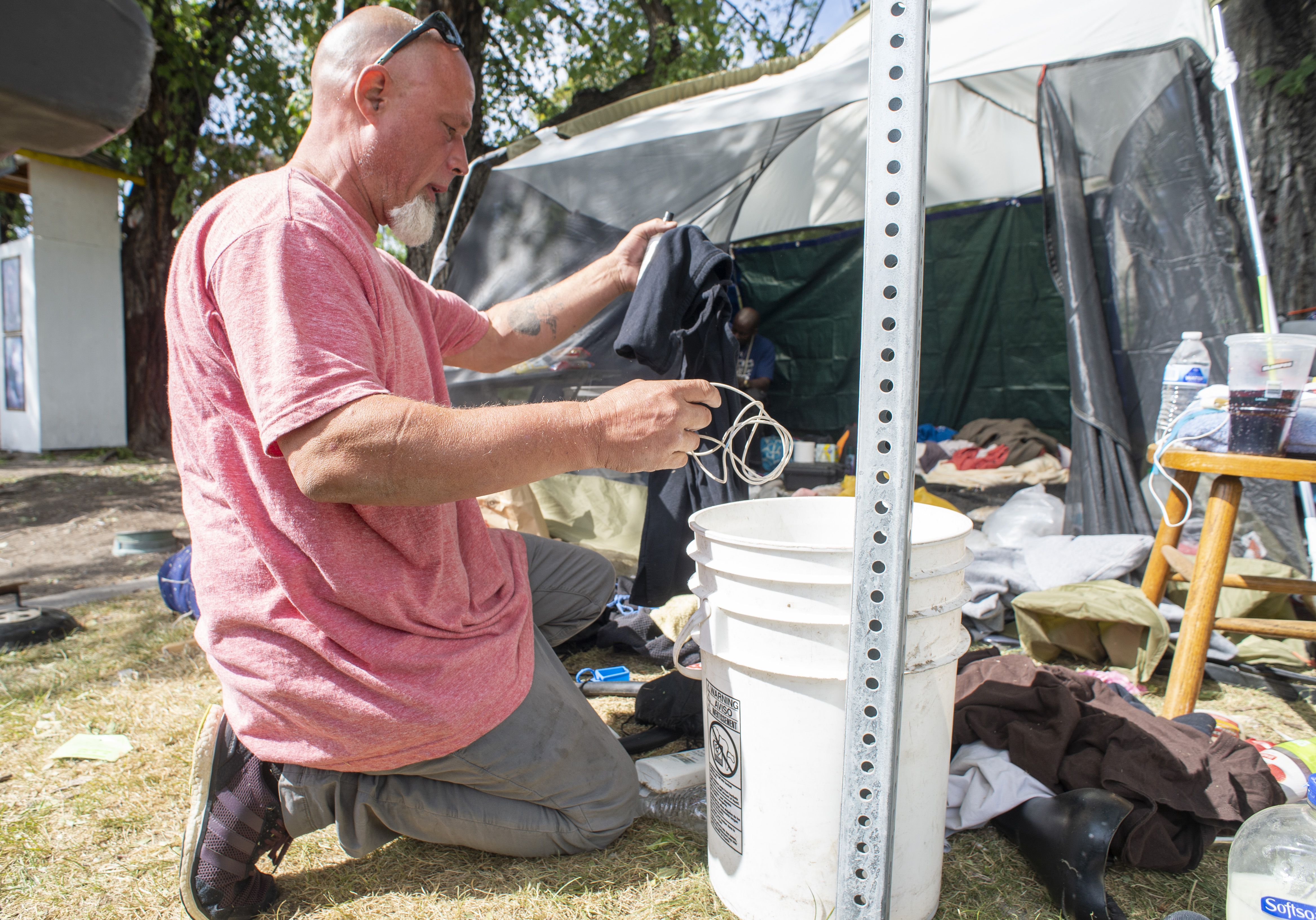 (Rick Egan  |  The Salt Lake Tribune) Richard Ryan prepares to move his camp on Wednesday, Sept. 9, 2020, after getting notified that first thing in the morning he will be forced to move from Taufer Park in Salt Lake City, fearing everything will be taken from him if he is not prepared when they arrive.