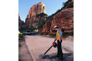 (Zion National Park via Twitter) Crews clean up the scene drive in Zion National Park after a rockfall Tuesday morning.