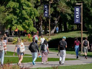 (Francisco Kjolseth | The Salt Lake Tribune) Students walk between classes at Provo's BYU in September 2022. An federal report shows BYU employees gave more often to a Democratic fundraising group than a Republican one.