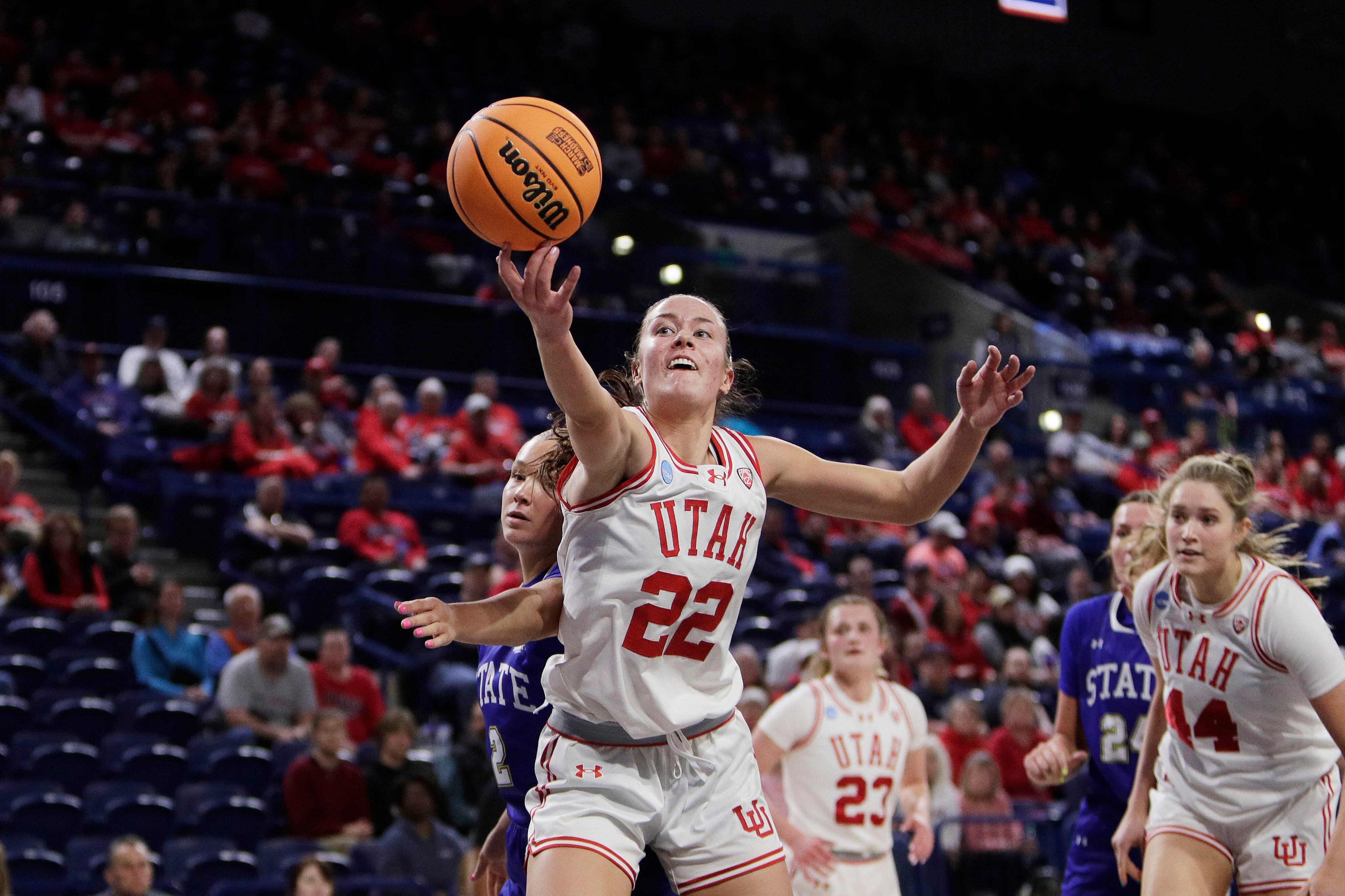 Utah forward Jenna Johnson (22) reaches for a rebound next to South Dakota State guard Jenna Hopp (2) during the first half of a first-round college basketball game in the NCAA Tournament in Spokane, Wash., Saturday, March 23, 2024. (AP Photo/Young Kwak)