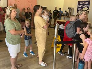 (Stefene Russell  |  The Salt Lake Tribune) Long lines of customers form during the first week in business for Banbury Cross Donuts' second location, in Centerville.