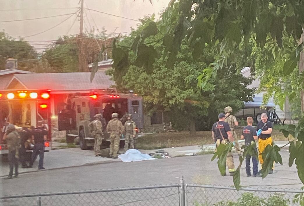 (Via a neighbor of Craig Robertson) A neighbor who requested anonymity shared this photo of FBI agents outside Robertson's Provo home following a raid during which agents shot and and killed Robertson.